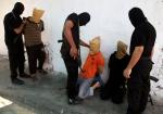 22 agosto 2014: miliziani nella città di Gaza pronti a giustiziare i palestinesi sospettati di spionaggio per Israele